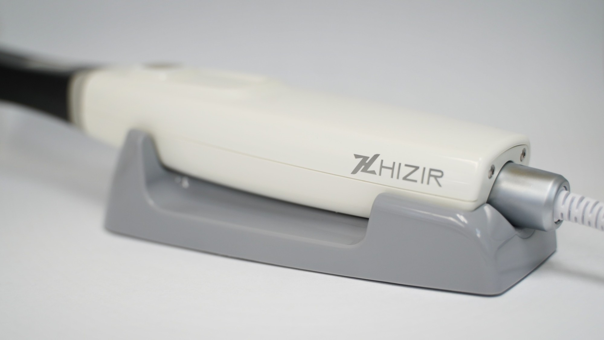 HiZir Intraoral Scanner handpiece resting in its docking cradle